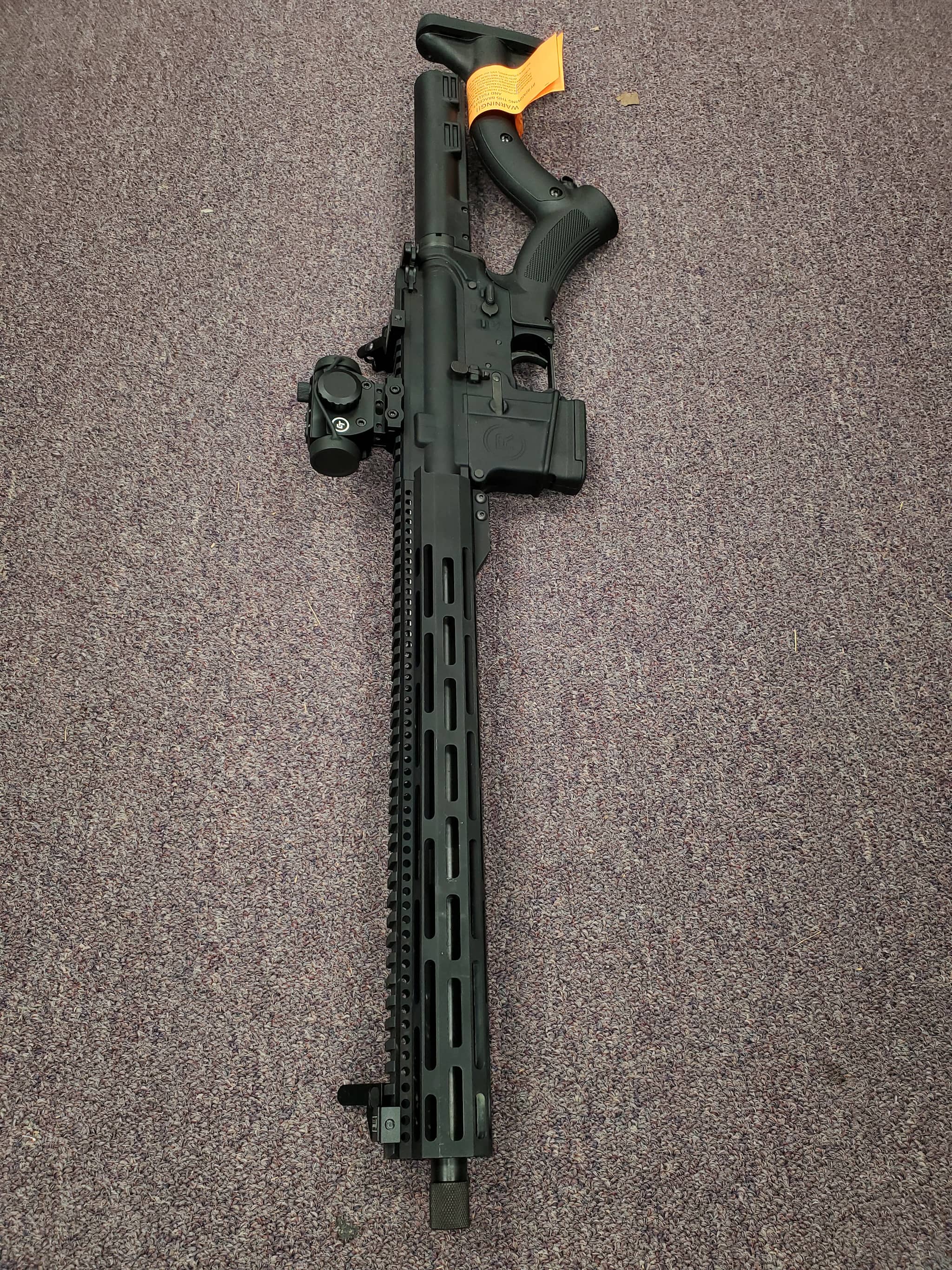 Image of RADICAL FIREARMS featureless AR-15 with red dot & iron sight